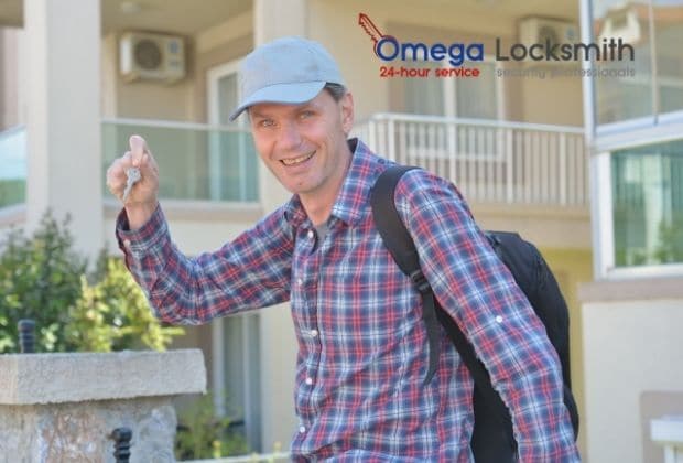 real estate agent holding keys from Omega Locksmith Chicago